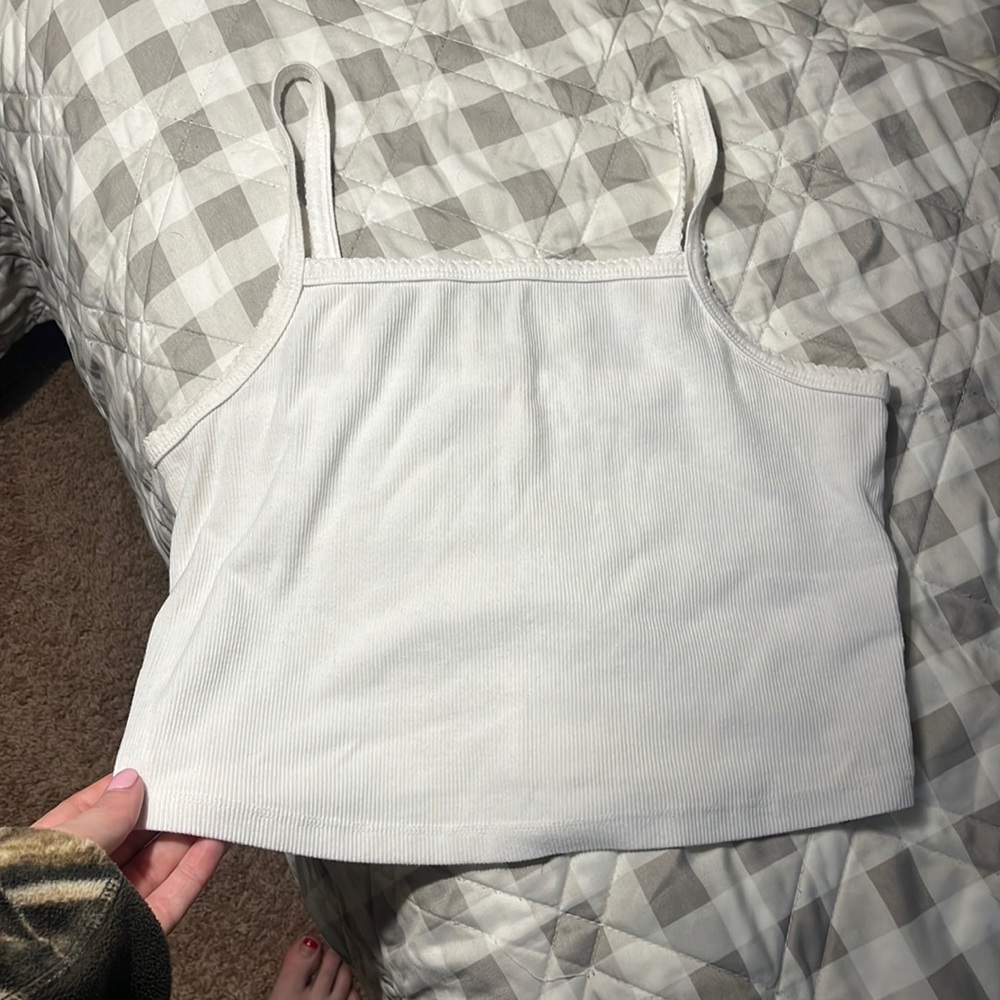 Colsie white tank bralette. Spot on front is tag on the inside peering through